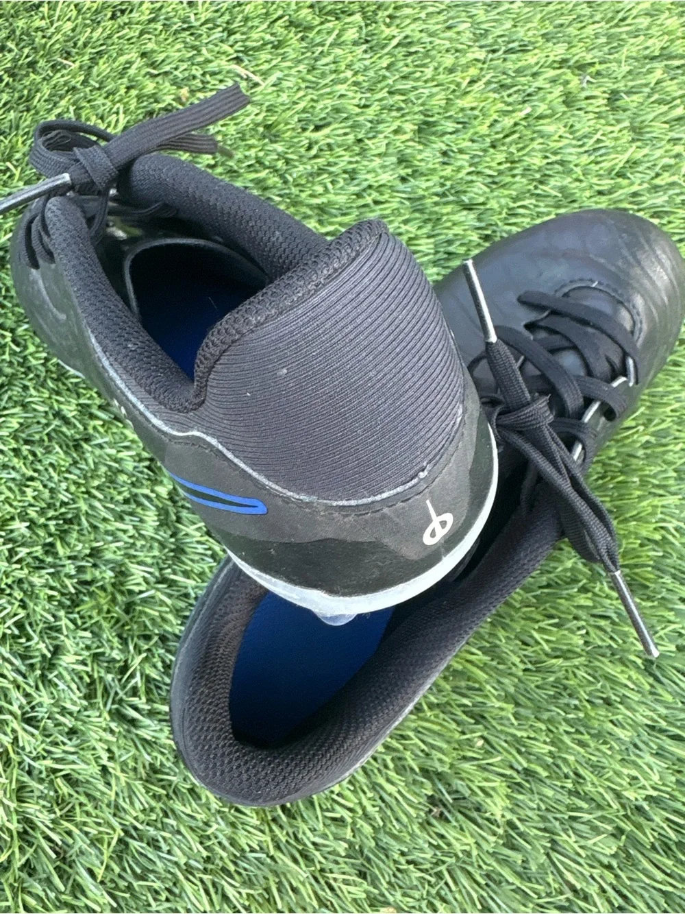 Nike Kids Black Soccer Cleats with Blue Accents